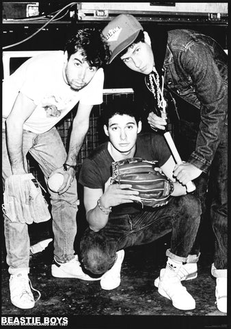 Three members of Beastie Boys posing with baseball equipment in a black and white photo.