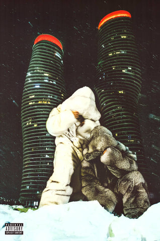 Person in a large fur coat standing in front of two tall buildings at night